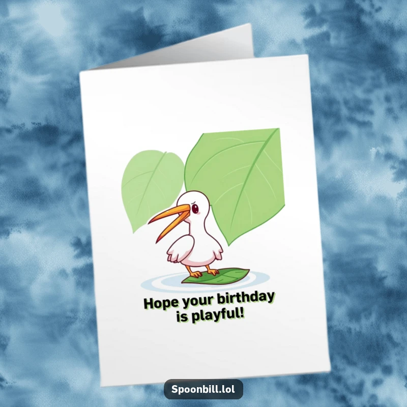 Funny Free Printable Birthday Card: Playful spoonbill with long beak gently taps a floating leaf, sending birthday cheer.